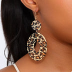 Leopard print dangle earrings by Shopimist featuring gold hooks and bold animal pattern for stylish accessories.