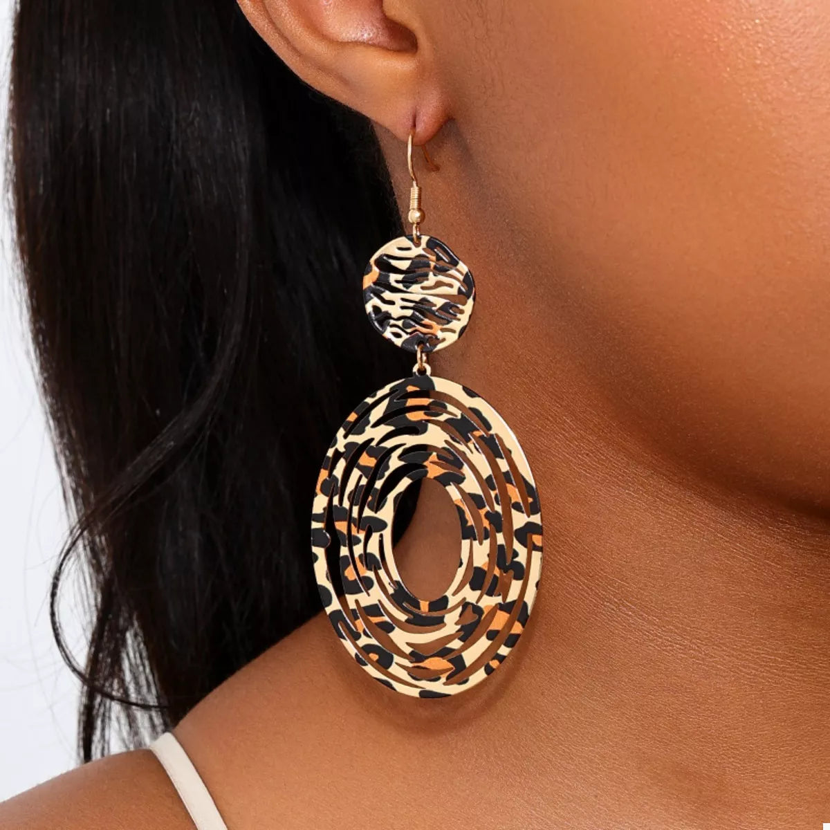 Leopard print dangle earrings from Plush Fashion Hub featuring bold animal pattern and stylish design.