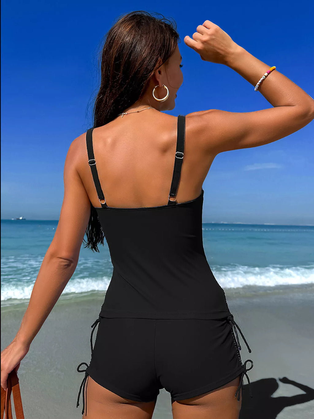 Floral print drawstring tankini set by Trendsi, two-piece swimwear with a colorful floral top and matching bottom on a model.