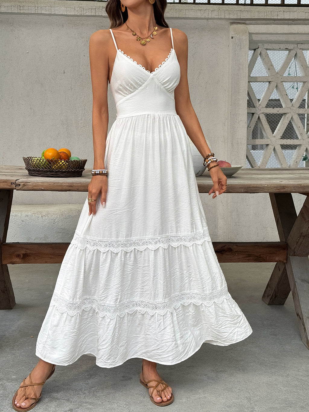 Women's V-neck tiered maxi dress with delicate lace details by Plush Fashion Hub, flowing fabric and elegant design.