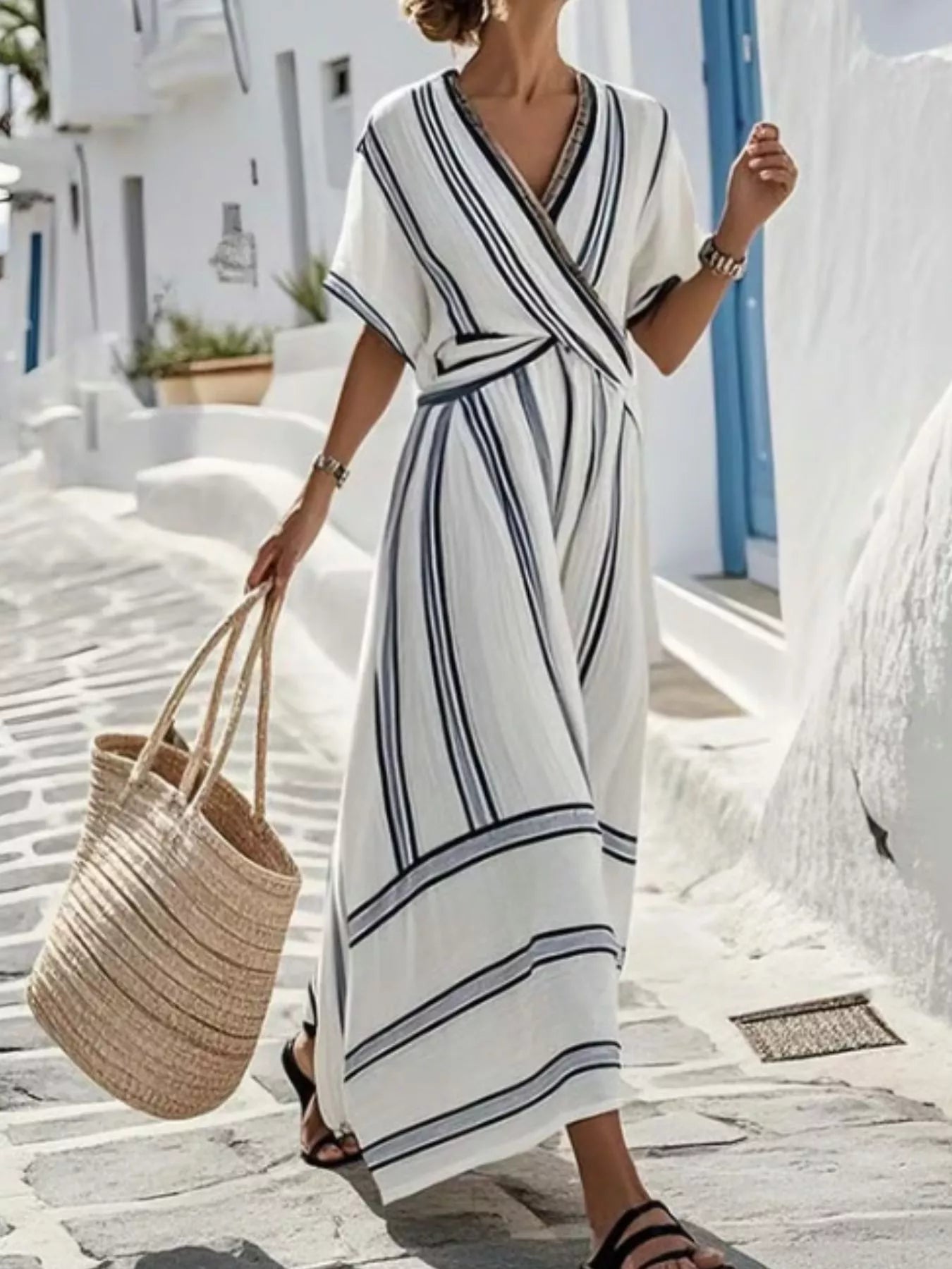 Plus size striped short sleeve wrap maxi dress by Trendsi, flowing fabric with a stylish full-length design and waist tie detail.