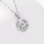 Sterling silver zircon pendant necklace with sparkling gemstone on a delicate chain, showcasing elegant jewelry design.