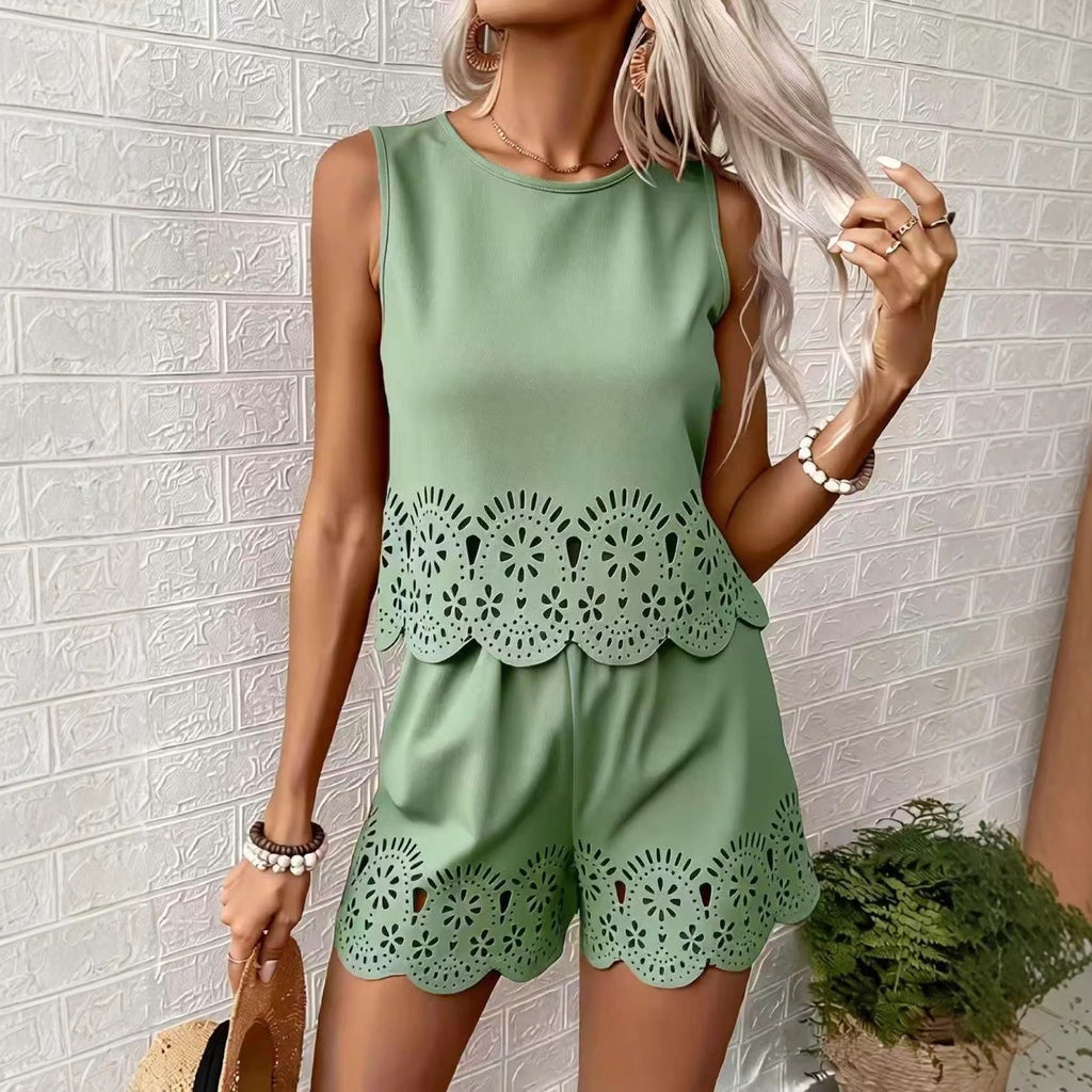 Women's elegant hollow-out floral top and pants set by FitiqueFit, casualwear with intricate floral and cut-out details.