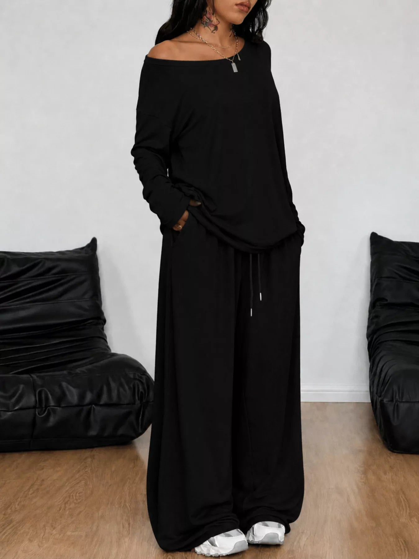 Plus size Trendsi loose fit one-shoulder T-shirt and pants set, showcasing the comfortable, casual style in a relaxed fit.