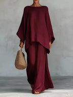 Plus size full size round neck top and wide-leg pants set by Trendsi, stylish matching pant set for casual wear.