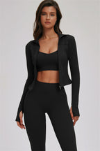 Fitglutes Activewear sports bra and leggings set featuring the Kinetic Zip Jacket Cross Back design, shown in a matching workout outfit.