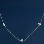 925 Sterling Silver Clover Charm Necklace with delicate pendant, showcasing a nature-inspired jewelry piece from Shopimist.