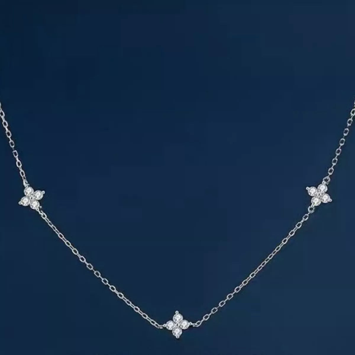 925 Sterling Silver Clover Charm Necklace with delicate pendant, showcasing a nature-inspired jewelry piece from Shopimist.