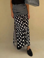 Flowy women's polka dot and striped slit maxi skirt by Trendsi, casual bohemian style with a relaxed, flowing silhouette.