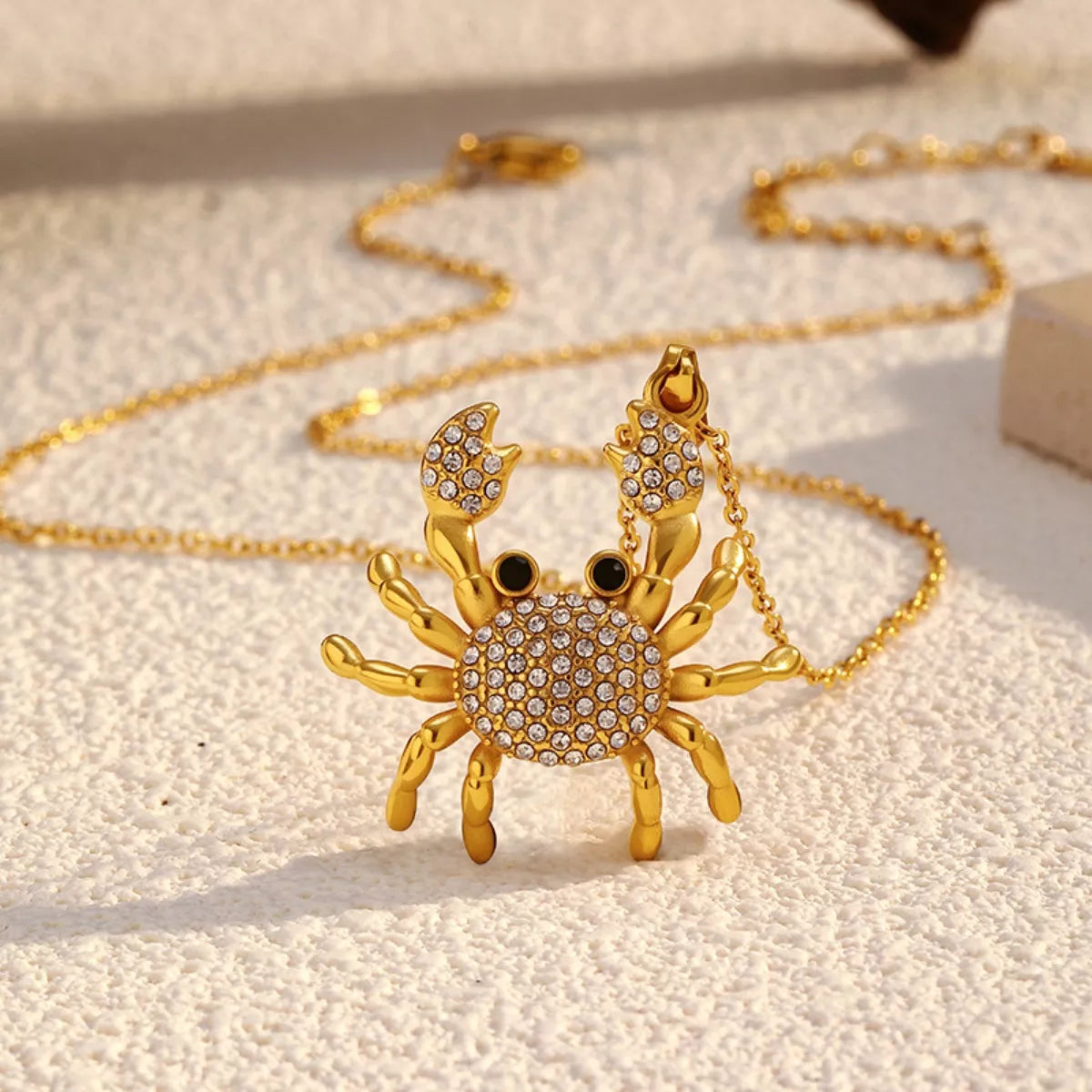 18K gold-plated crab pendant necklace with detailed crab design, showcasing elegant jewelry craftsmanship.