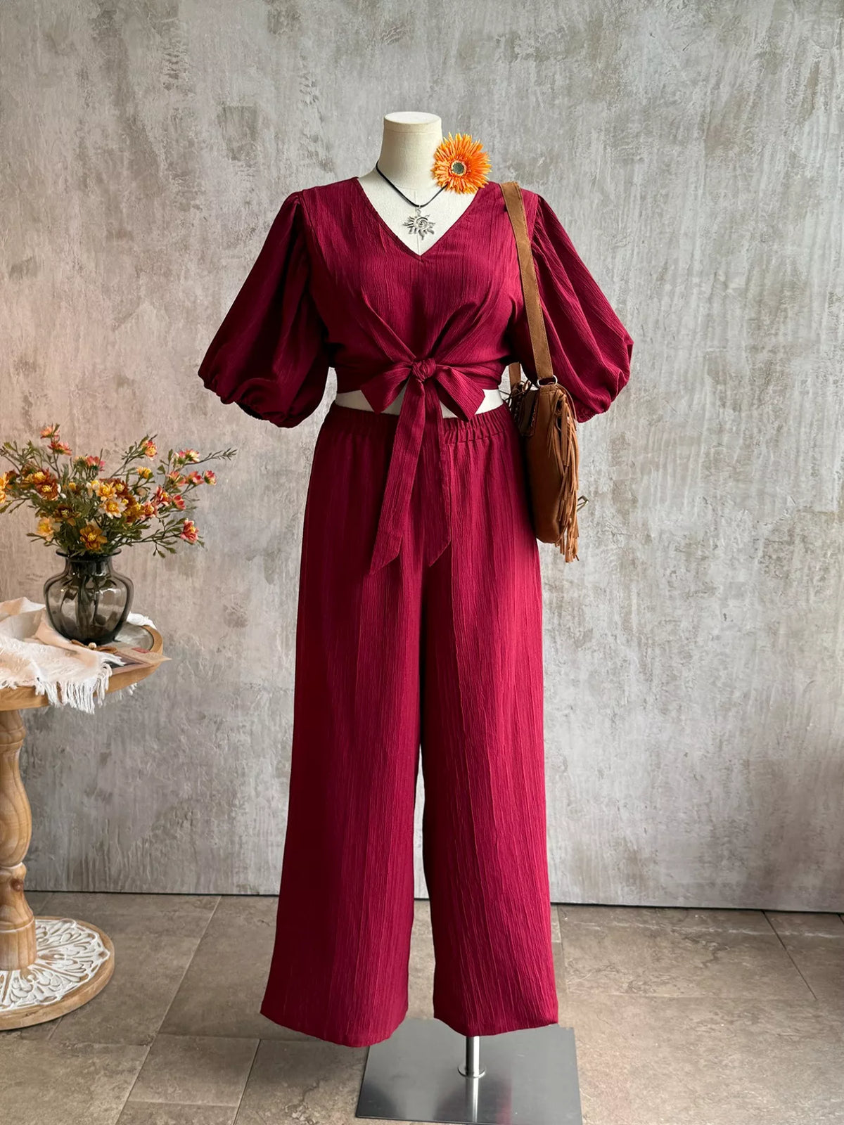 Plus size tie-front puff sleeve top and wide-leg pants set by Plush Fashion Hub, stylish two-piece outfit for casual or dressy wear.