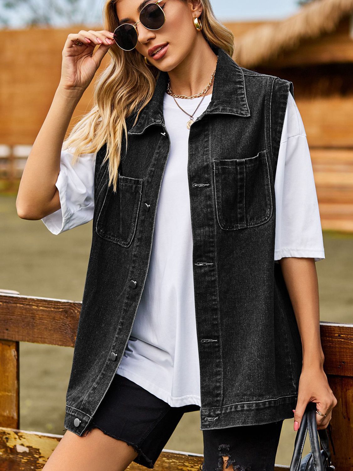 VYSN button down denim vest with front pockets, sleeveless casual fashion clothing for women or men.
