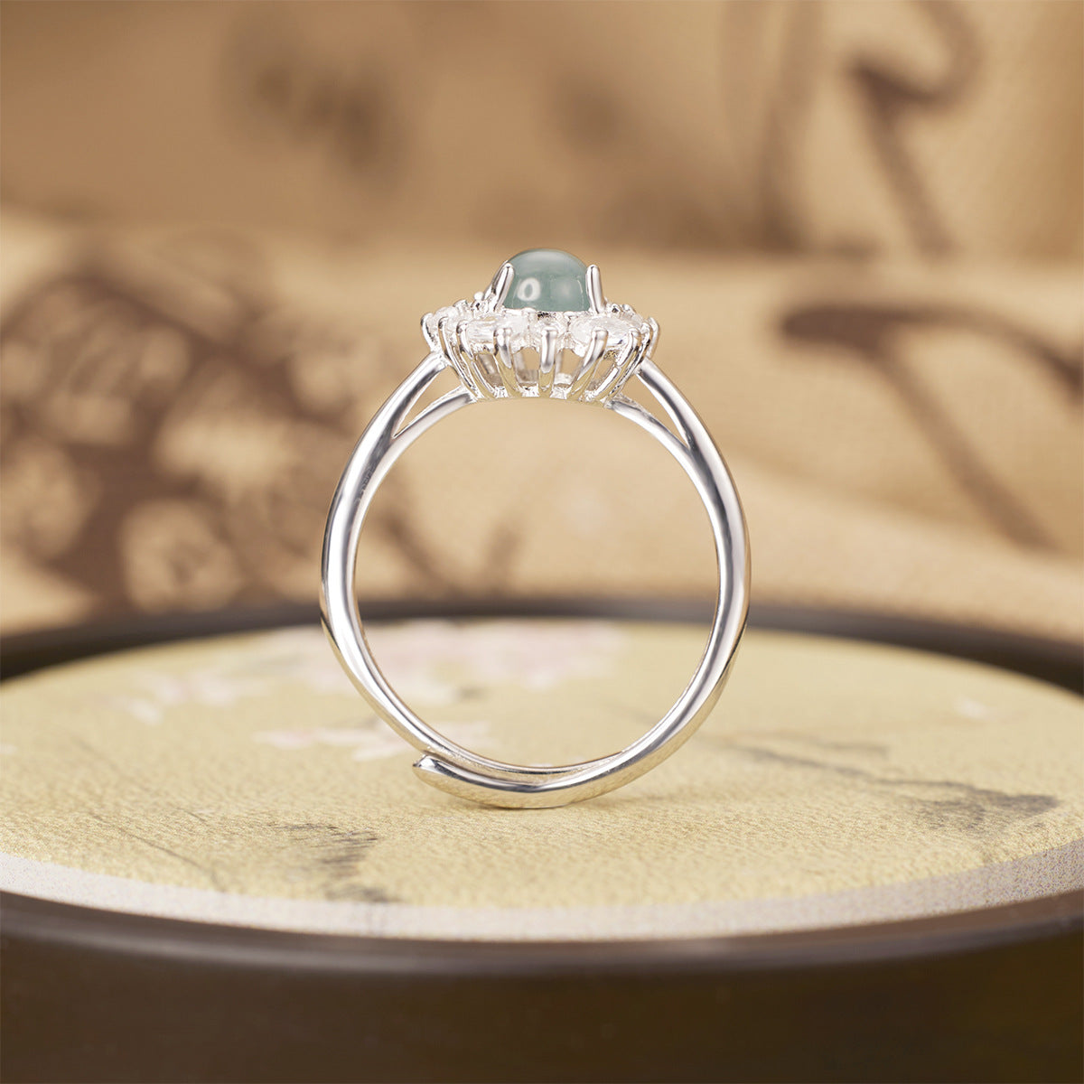 925 sterling silver jadeite ring with a smooth, polished jadeite gemstone set in a sleek silver band.