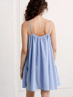 Polka dot spaghetti strap mini dress by Shopimist, featuring a fitted silhouette and stylish design, shown on a model.