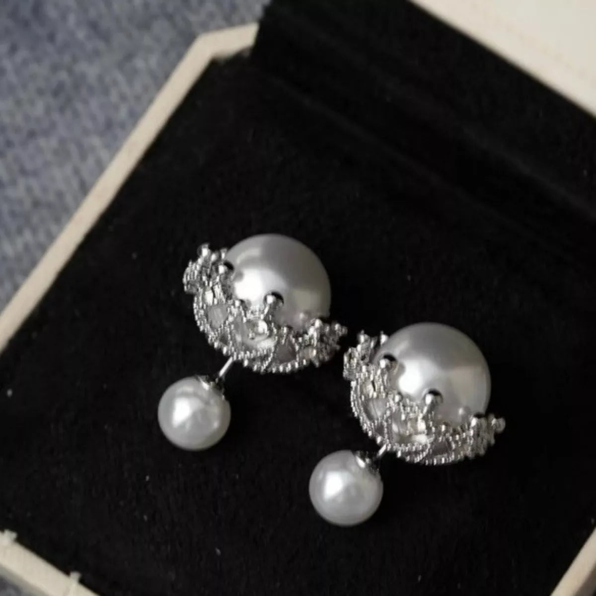 Elegant pearl stud earring by Plush Fashion Hub featuring a classic white pearl on a sleek metal post.