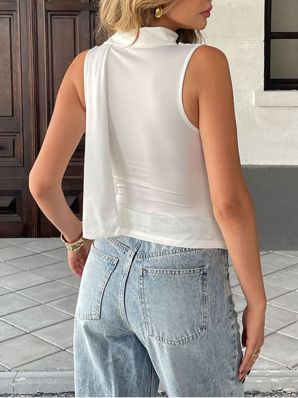 Satin-feel sleeveless blouse with cowl neck and ruched details, versatile elegant cami top by Trendsi.