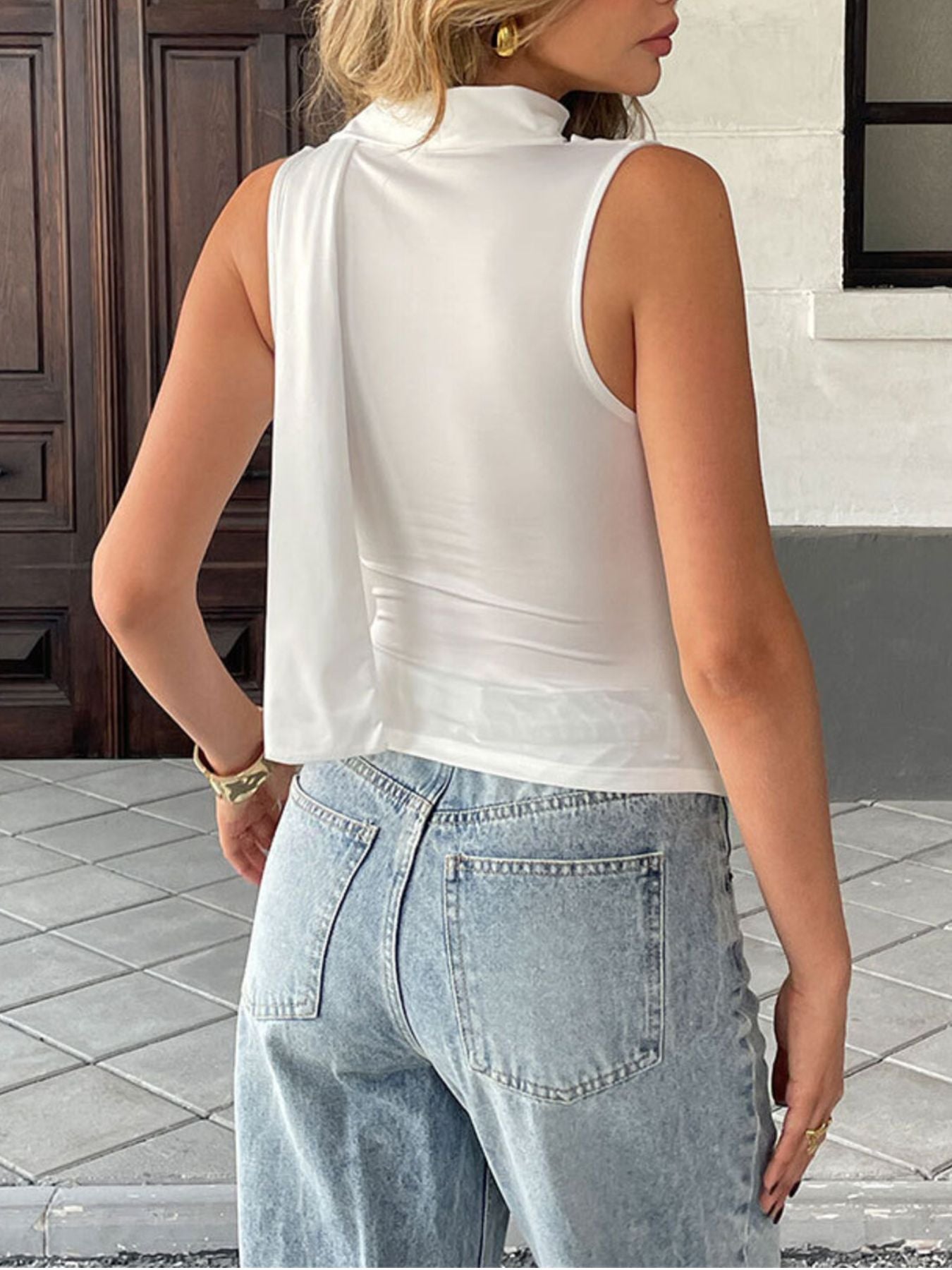 Satin-feel sleeveless blouse with cowl neck and ruched details, versatile elegant cami top by Trendsi.