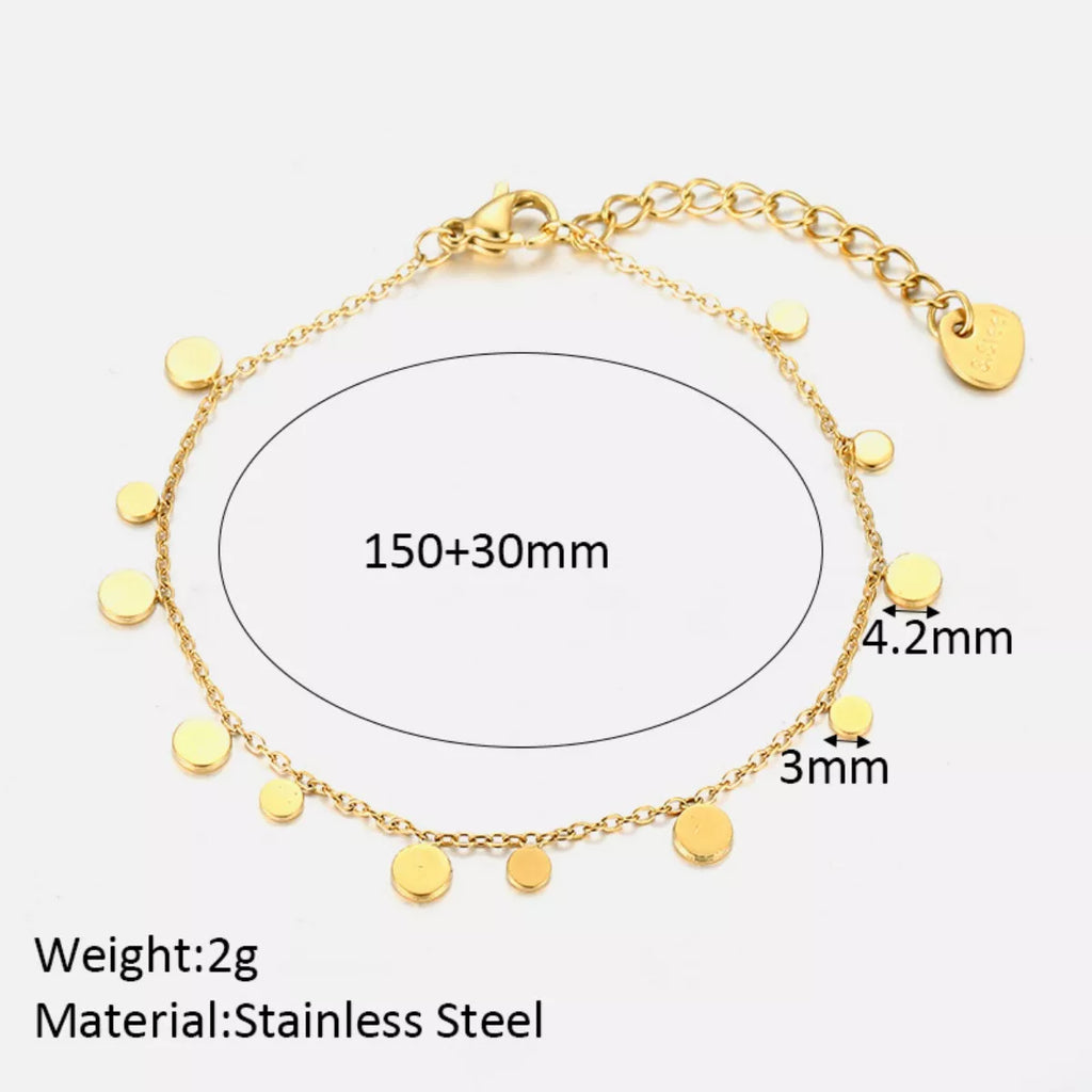 18K gold-plated charm bracelet with delicate charms and intricate design, showcasing elegance and craftsmanship.