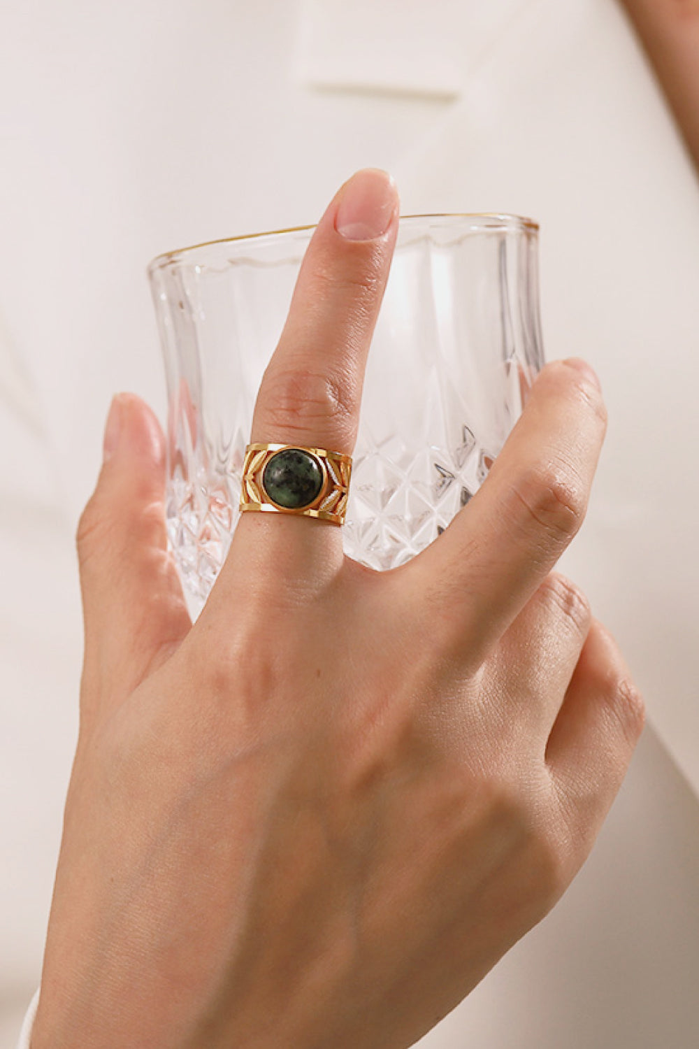 18k gold plated malachite leaf ring with intricate design, showcasing vibrant green stone and detailed leaf motif.
