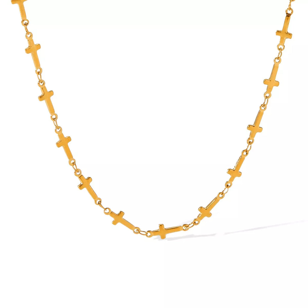 18K gold-plated cross necklace with detailed pendant, showcasing a stylish and elegant jewelry piece.