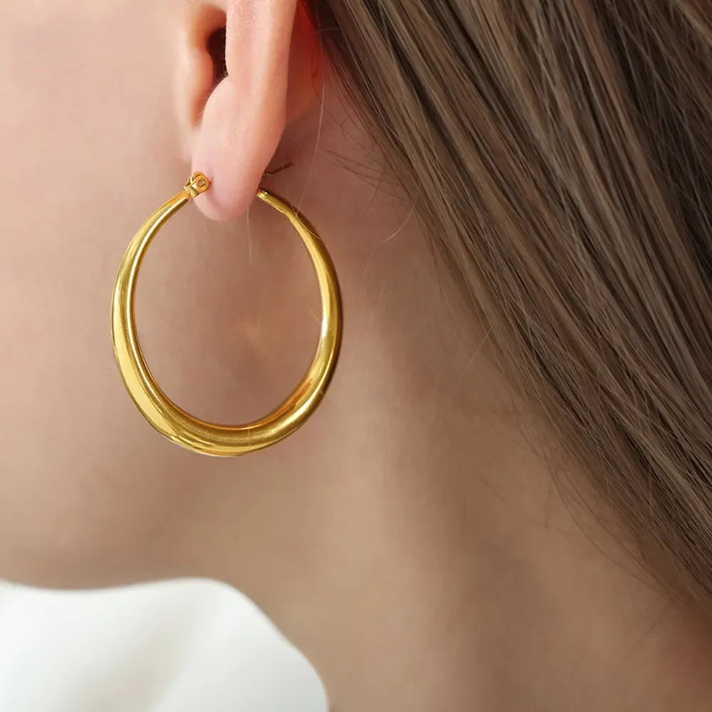 Gold-plated hoop earrings with a polished finish, stylish accessory by Shopimist, perfect for everyday wear and elegant occasions.