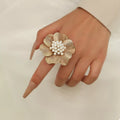 18K gold-plated pearl flower ring featuring delicate floral design and shimmering pearls, perfect for elegant jewelry occasions.