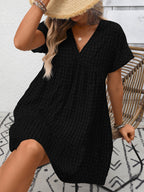 Plush Fashion Hub plaid V-neck mini dress with ruffle hem, lightweight and stylish for seasonal fashion, shown on a model.