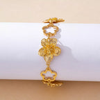 18K gold-plated flower bracelet with delicate floral charms, showcasing elegant jewelry design and craftsmanship.