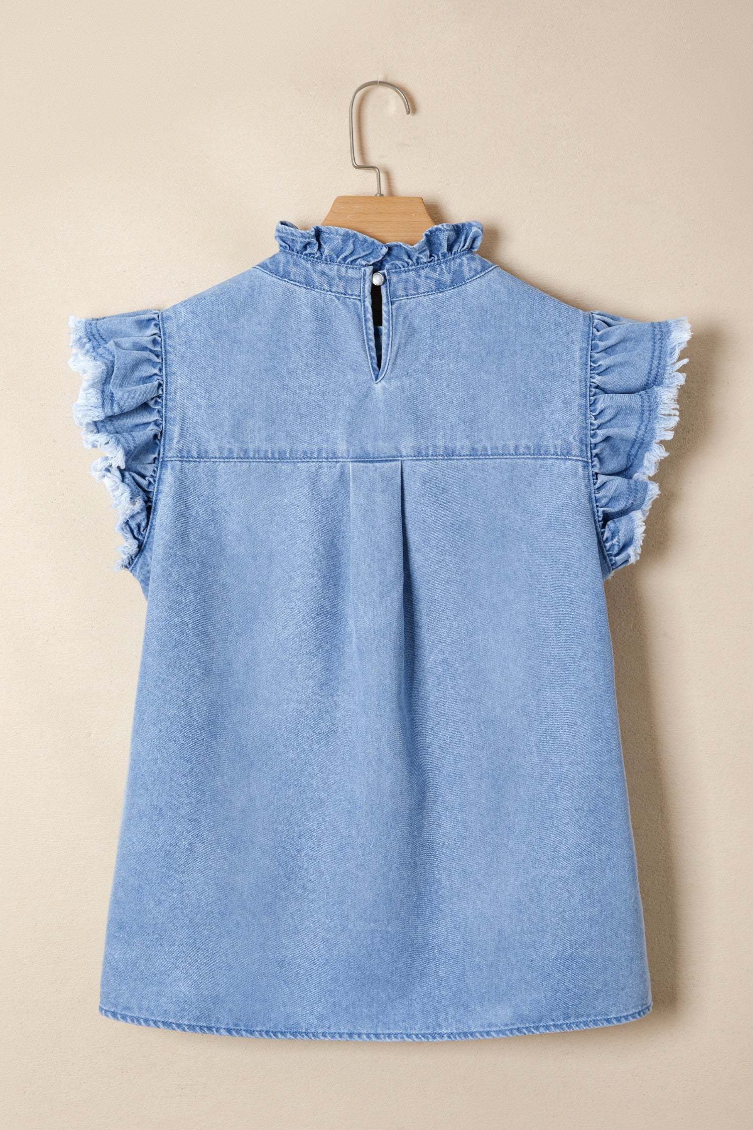 Women's distressed denim top with frilled collar and flutter sleeves, stylish and casual Trendsi women's fashion top.