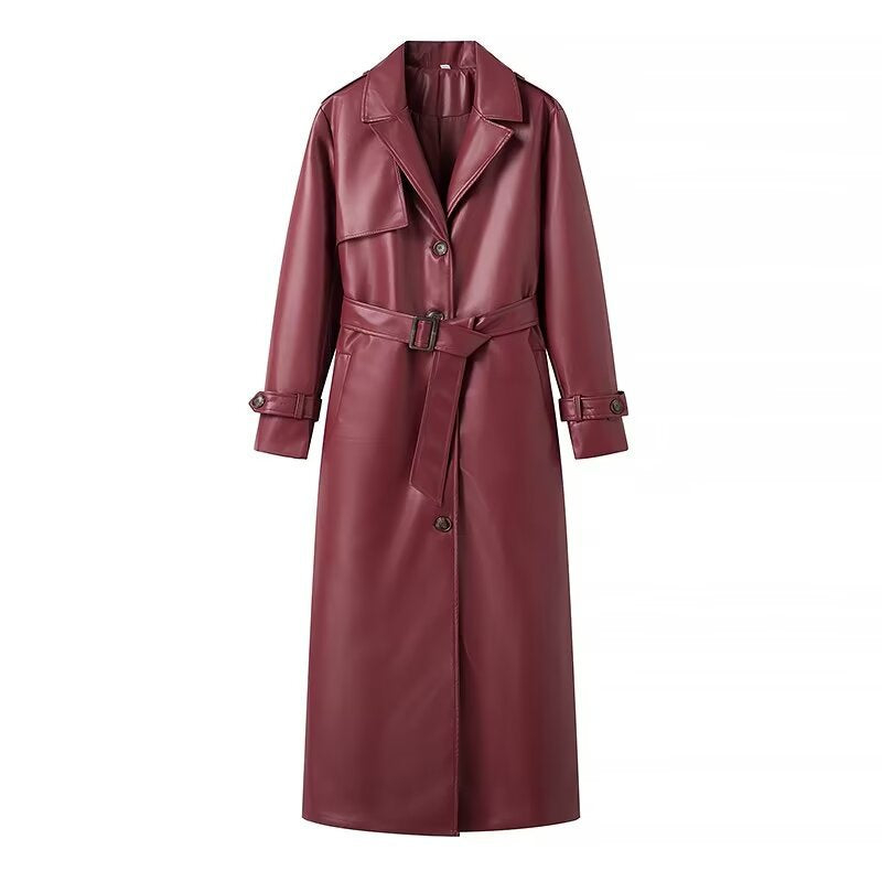 Burgundy faux leather trench coat featuring lapels, front buttons, buckled belt, and cuff straps.