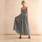 Women's retro plaid sleeveless A-line maxi dress by FitiqueFit with fitted waist and pleated sundress style, casualwear outfit.