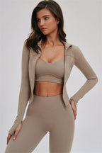 Fitglutes activewear 3-piece set with kinetic zip jacket, cross-back sports bra, and matching leggings for workout comfort.