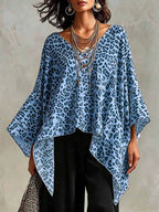 Plus size leopard print asymmetrical hem top from Trendsi, featuring a stylish and flowy design with bold animal print.