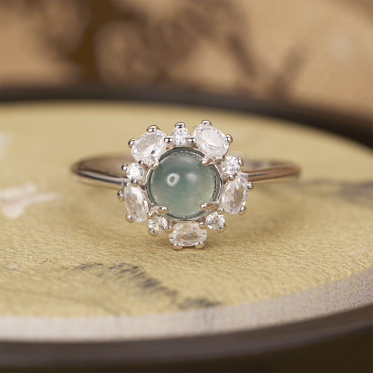 Sterling silver jadeite ring featuring a vibrant green jadeite gemstone set in a polished band.