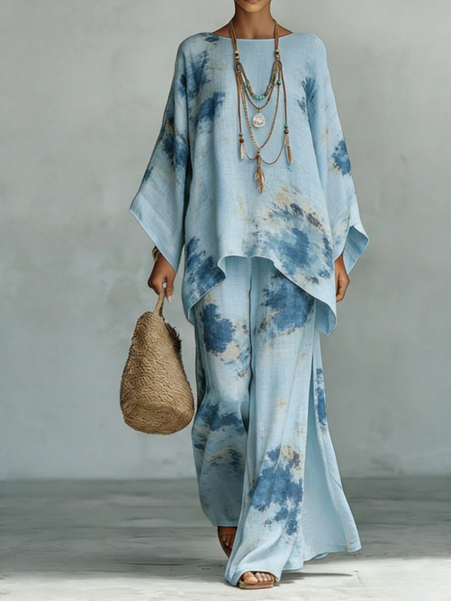 Floral print bamboo linen two-piece set by FitiqueFit featuring wide-leg pants and a matching top on a model.