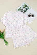 Simply Love bow print lettuce trim round neck top and shorts lounge set, featuring a relaxed fit and matching bow details.
