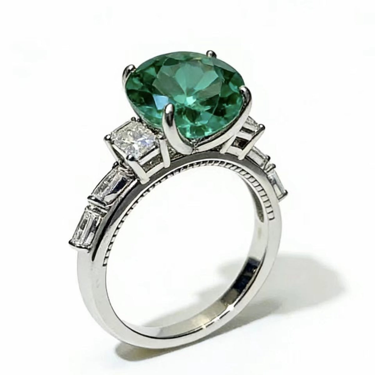 Sterling silver ring with an 8-carat moissanite gemstone, elegant jewelry piece with detailed band design.