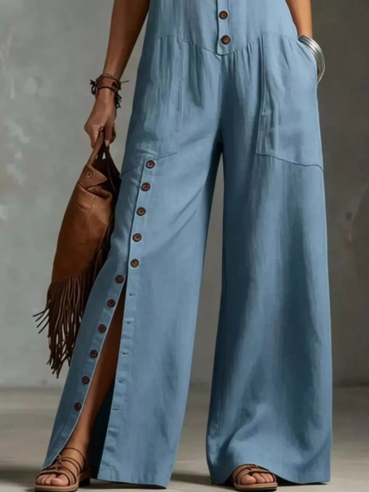 Plus size sleeveless button-front wide-leg jumpsuit by Plush Fashion Hub, featuring a full-length design and stylish fit.