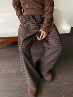 Men's plaid wide-leg casual pants with drawstring waist by Trendsi, shown in a relaxed fit fabric with a stylish plaid pattern.