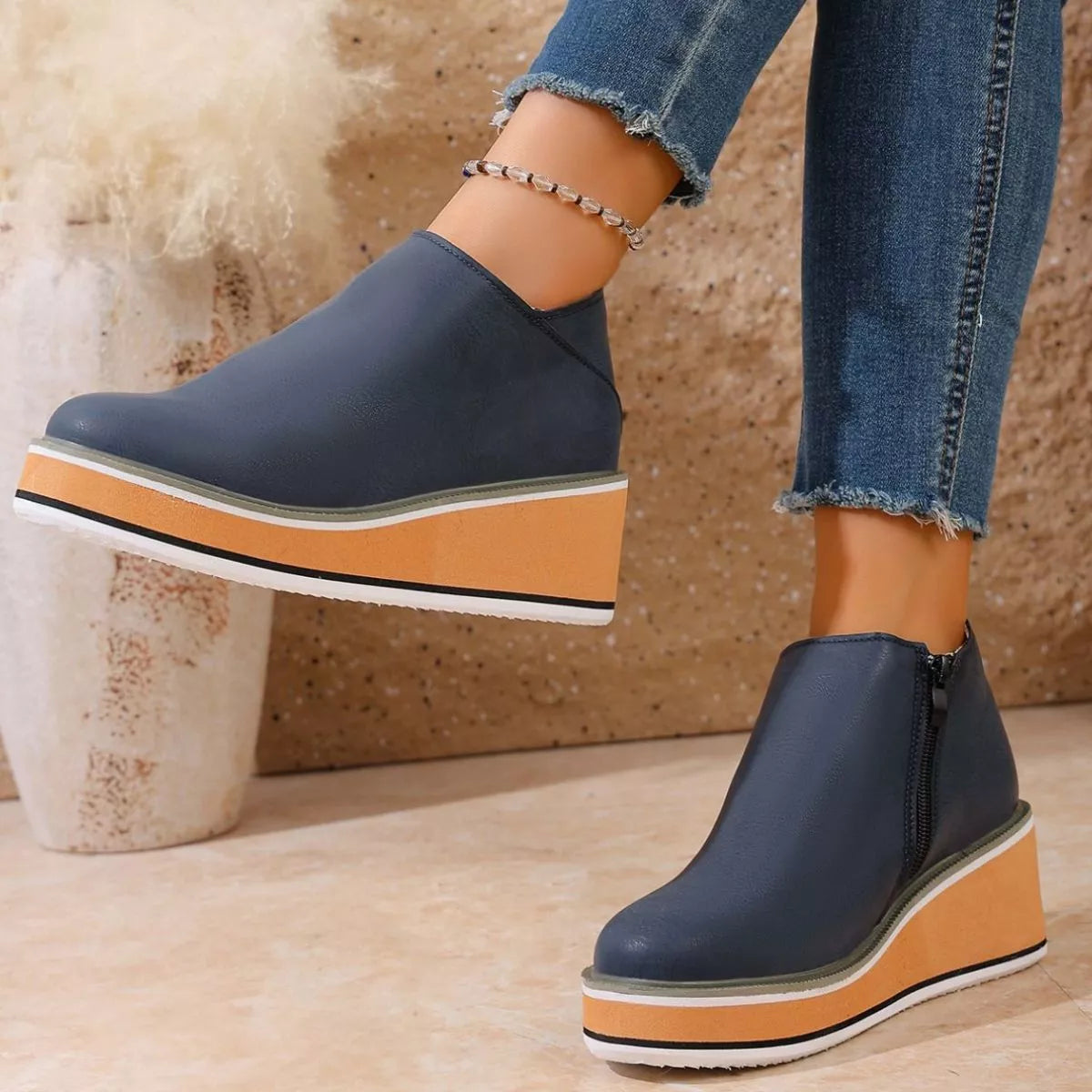 Women's round toe wedge ankle boots by Trendsi featuring a stylish design and ankle height, perfect for casual or dressy outfits.