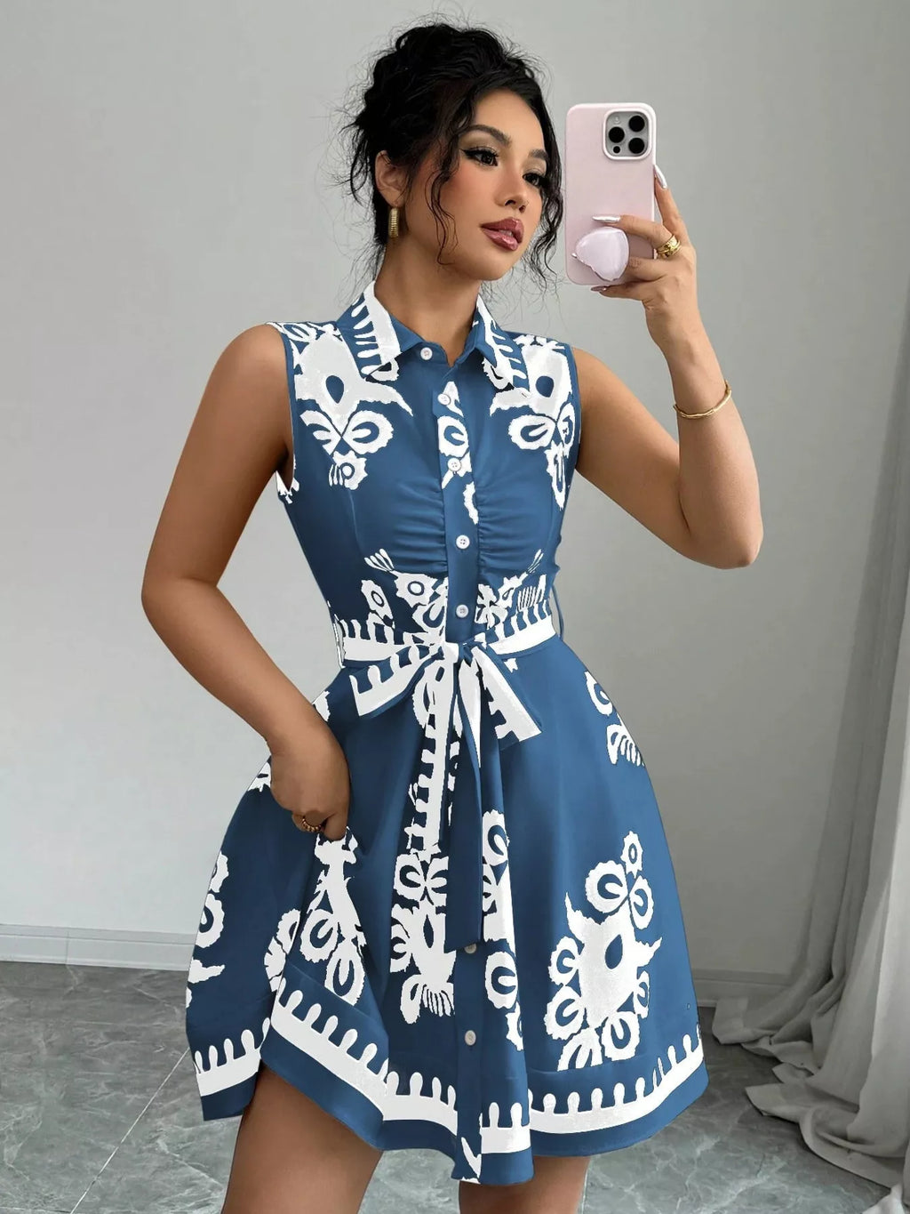Sleeveless printed ruched tie waist dress by Shopimist featuring a flattering silhouette and stylish design.