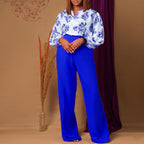 Printed floral lace-up top and wide-leg pants set by FitiqueFit, featuring colorful floral patterns in a casualwear style.
