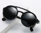 Round steampunk sunglasses by FitiqueFit featuring vintage-inspired metal frames and intricate design details.
