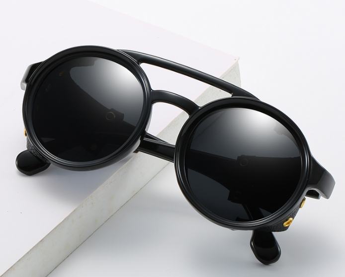 Round steampunk sunglasses by FitiqueFit featuring vintage-inspired metal frames and intricate design details.