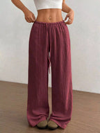 Wide-leg drawstring pants by Trendsi featuring a relaxed fit and casual style, shown in a neutral fabric with a comfortable waistband.