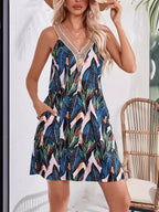 Tropical leaf print v-neck sleeveless dress from Shopimist, featuring vibrant green foliage and lightweight fabric.
