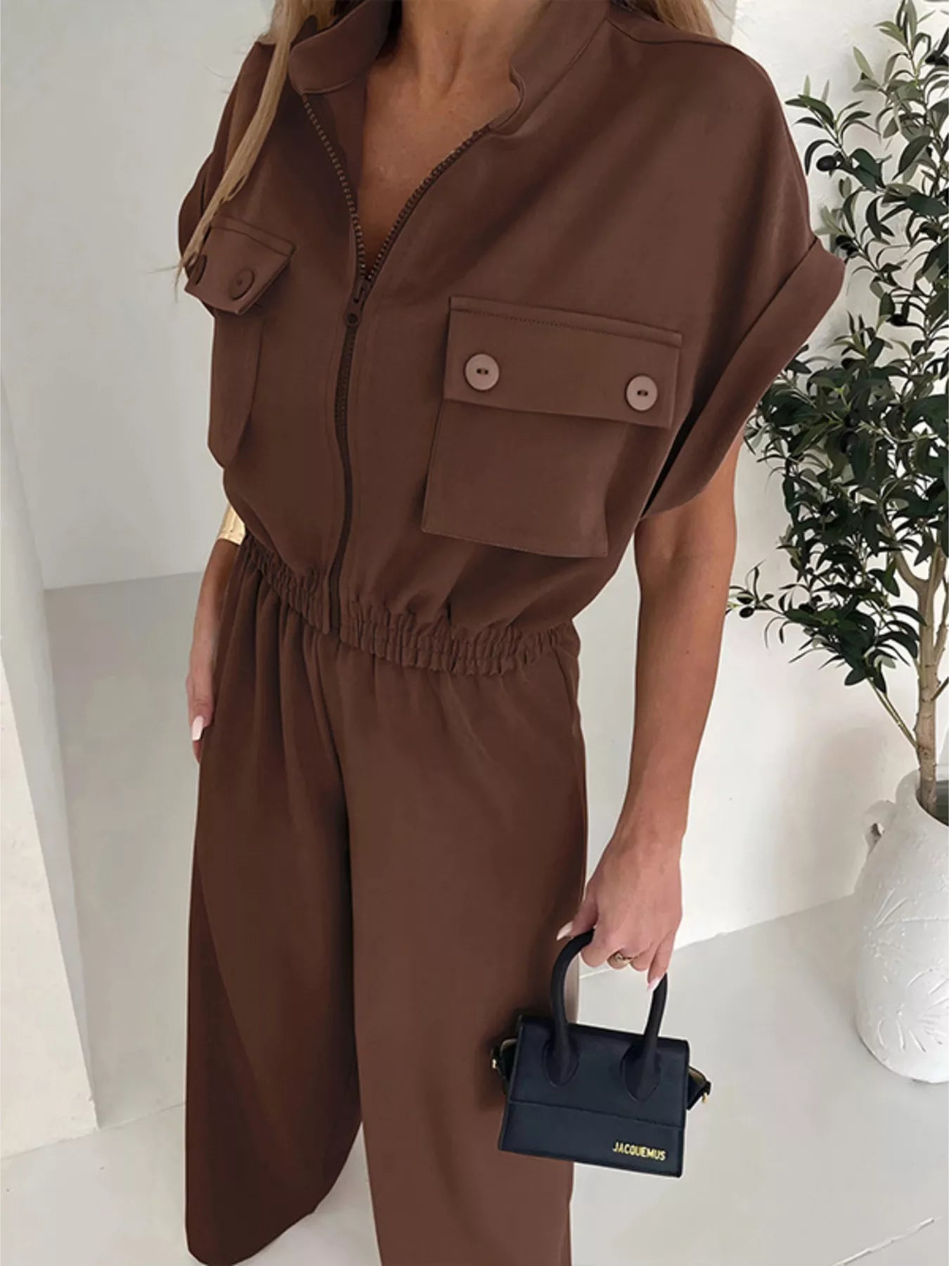Cargo pocket zipper front jumpsuit by Plush Fashion Hub, featuring a stylish design with front zipper and multiple cargo pockets.