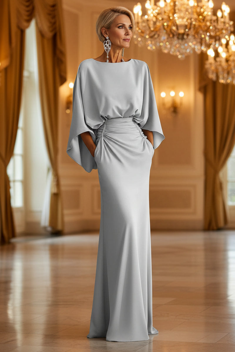 Elegant silver women's backless pleated batwing sleeve maxi dress by FitiqueFit, featuring a mermaid gown silhouette and flowing design.