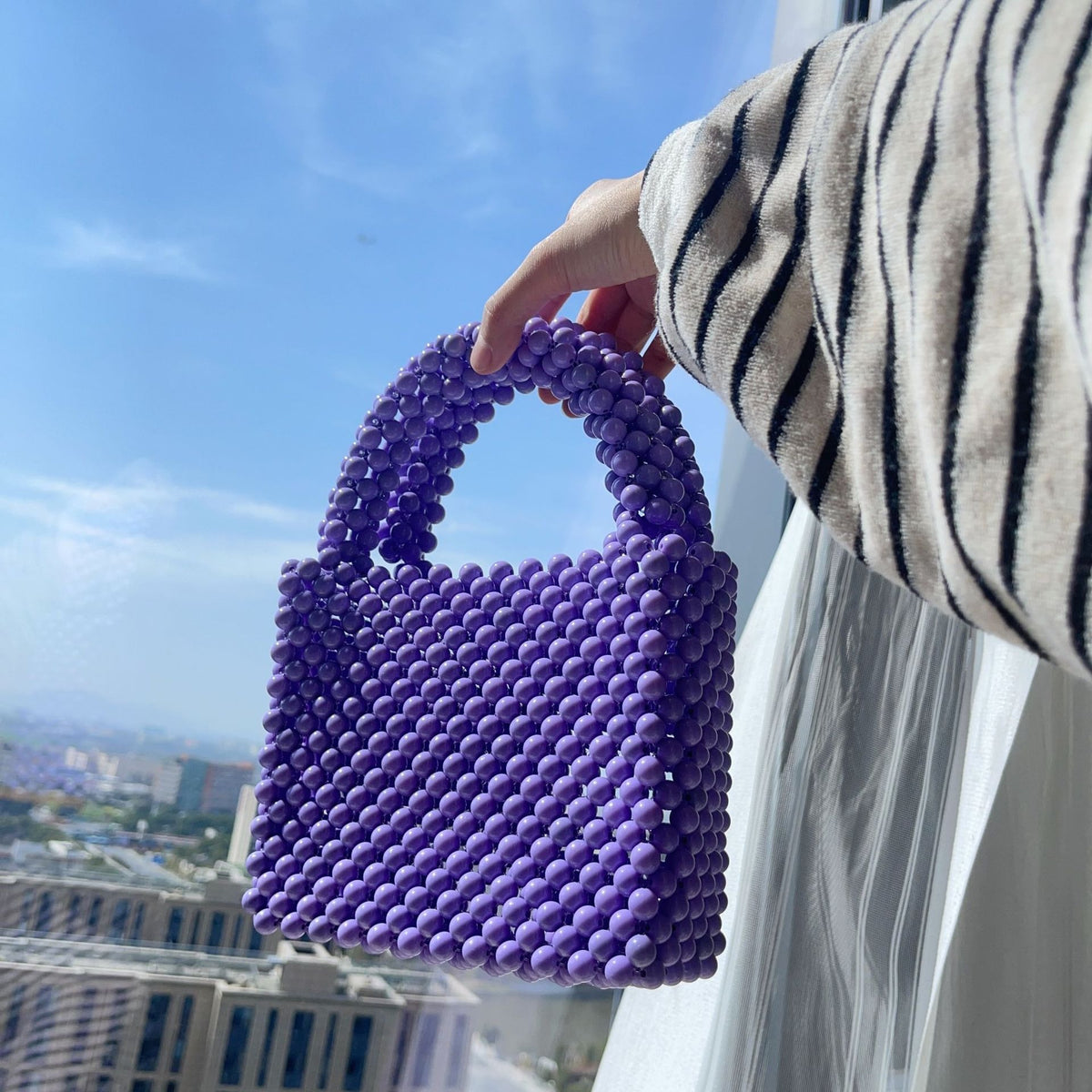 Eprolo beaded handbag with solid color design, featuring intricate beadwork and a stylish, compact accessory for fashion occasions.