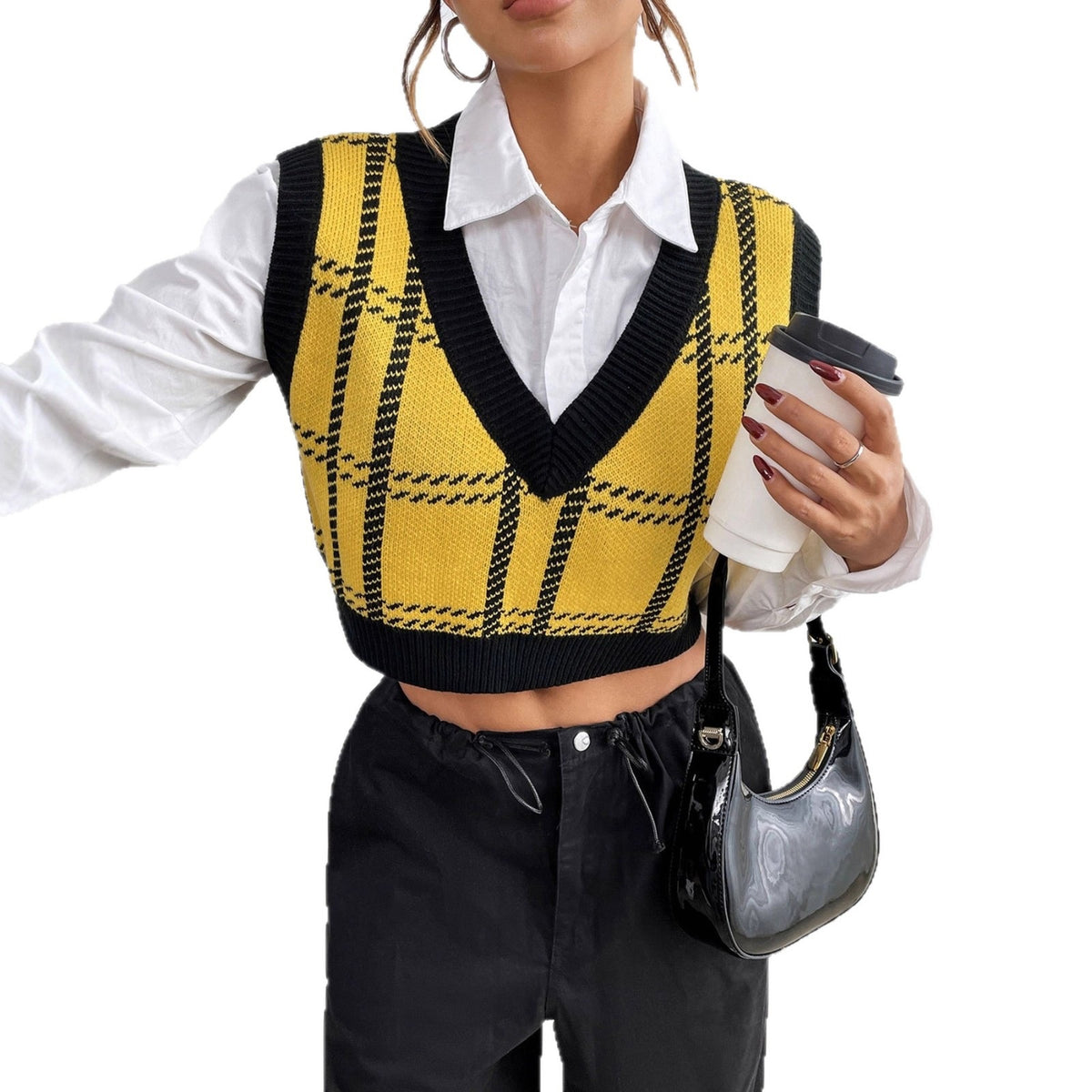 Yellow and black plaid knit sweater vest with V-neck, layered over a white button-down shirt.